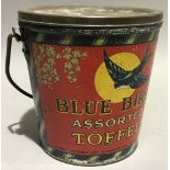 A Blue Bird Toffee seaside bucket tin