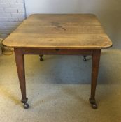 A Victorian oak extending dining table