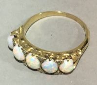 An 18 ct gold opal and diamond ring