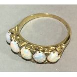 An 18 ct gold opal and diamond ring