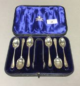 A cased set of silver teaspoons and tongs