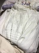 A quantity of linen and lace, including Christening gowns, etc.