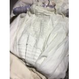 A quantity of linen and lace, including Christening gowns, etc.