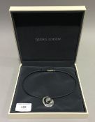 A boxed Georg Jensen silver pendant