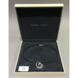 A boxed Georg Jensen silver pendant