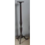 An Edwardian mahogany torchere