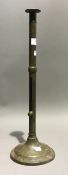 An 18th century elongated brass ejector candlestick