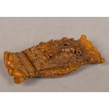 A 19th century carved coquilla nut snuff box The hinged lid carved with two figures,