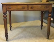 A small Victorian two drawer writing table