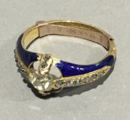 A gold diamond and enamel ring