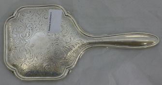 An unmarked silver hand mirror