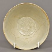 A Chinese Song dynasty porcelain bowl The interior with moulded decoration. 14.5 cm diameter.
