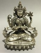 A silver plated model of Buddha