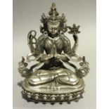 A silver plated model of Buddha