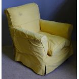 A yellow upholstered armchair