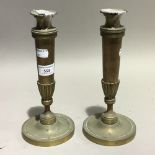 A pair of brass candlesticks