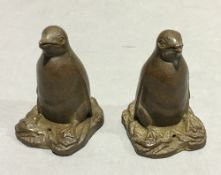 A pair of bronze penguins