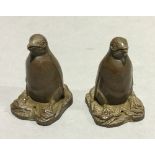 A pair of bronze penguins