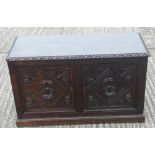 A low carved oak side cupboard/coffer