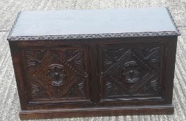 A low carved oak side cupboard/coffer