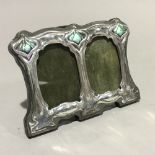 A double silver and enamel Art Nouveau style frame