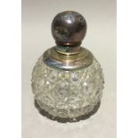A silver mounted cut glass scent bottle
