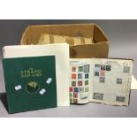 A stamp collection containing a large quantity of Fist Day covers, loose stamps,