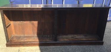 A long Victorian carved oak bookcase