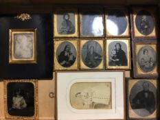 An early Victorian papier mache frame containing a photographic portrait, stamped Beard,