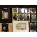 An early Victorian papier mache frame containing a photographic portrait, stamped Beard,