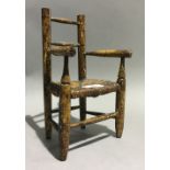 A scumble glazed miniature rush seated vernacular country chair