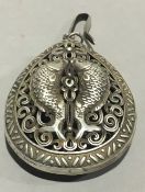 A pendant decorated with fish