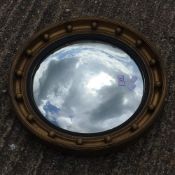 A gilt framed convex mirror