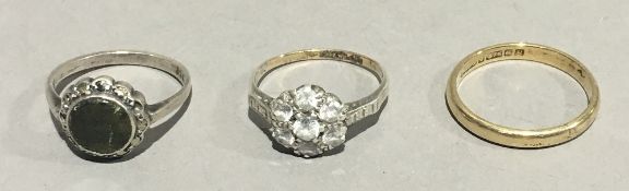 Two 9 ct gold rings and a silver ring