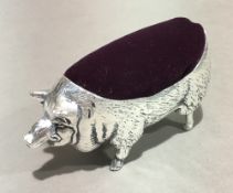 A pin cushion in the form of a pig