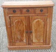 A small 19th century pine side cupboard
