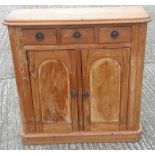 A small 19th century pine side cupboard