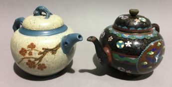 A 19th century Japanese cloisonne teapot and cover, and an unusual Chinese Y Hsing teapot,