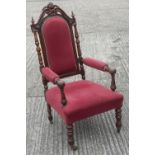 A Victorian upholstered oak open armchair