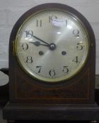 A Victorian inlaid mantle clock