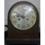 A Victorian inlaid mantle clock