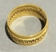 An 18 K gold wedding band