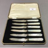 A cased set of silver and mother-of-pearl knives