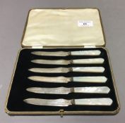 A cased set of silver and mother-of-pearl knives