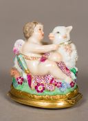 A 19th century Continental porcelain patch box Formed as cupid and a sheep, inscribed A.