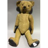 A large vintage teddy bear,