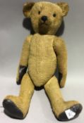 A large vintage teddy bear,