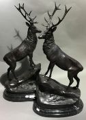 A pair of bronze stags