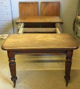 A Victorian mahogany two leaf extending dining table