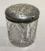 A silver topped cut glass pot,